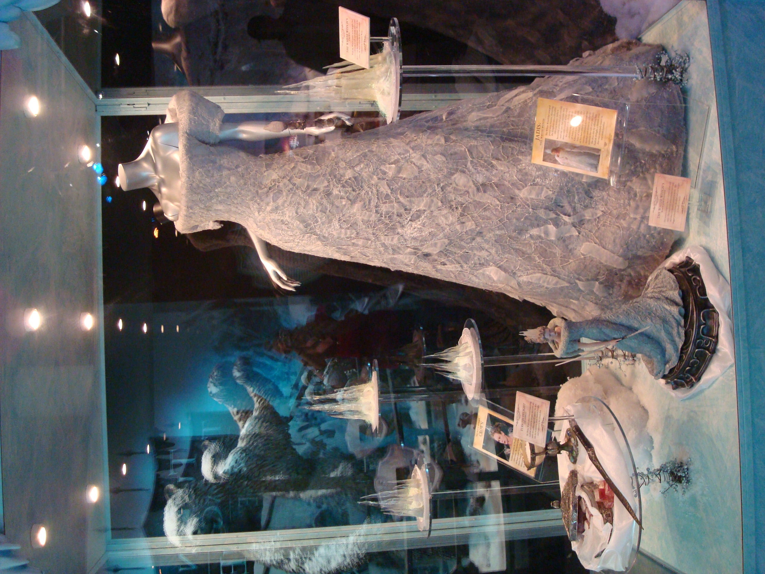 White gown mannequin lit room