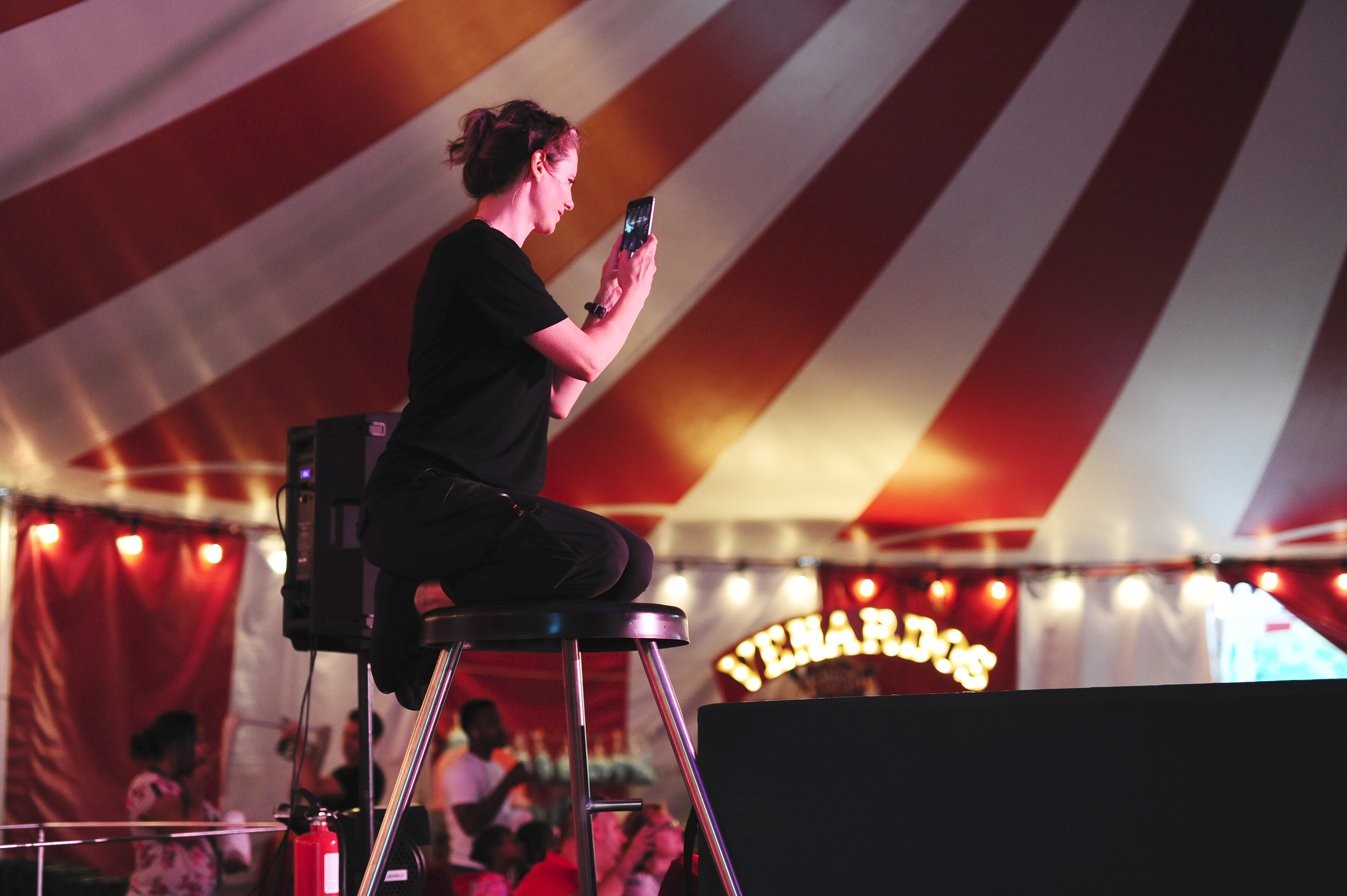 Performer on stool